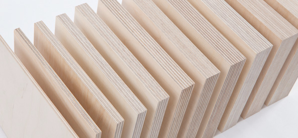 Birch raw plywood panels showing cross-laminated veneer layers in various thicknesses