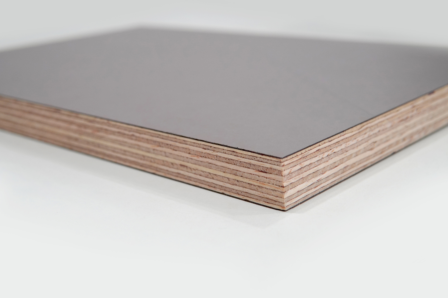 TOP Form premium HDO film faced plywood panels stacked showing dark brown high-density overlay surface